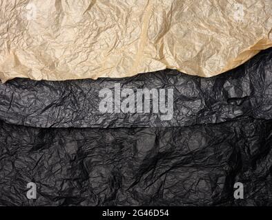 Crumpled black and brown paper, abstract texture background Stock Photo