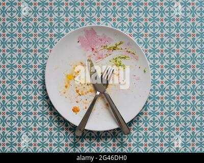 Dirty plate after healthy vegetarian paleo lunch Stock Photo
