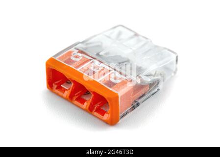 3-terminal self locking splicing connector for stranded and solid wires for electric cables, isolated on white background. Stock Photo