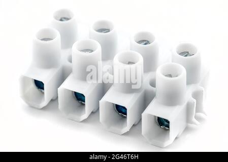 Plastic connection block with 4 entries for strands and solid conductors for electric cables, isolated on white background. Stock Photo