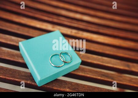 Wedding rings of the newlyweds in a box. Engagement gold rings Stock Photo