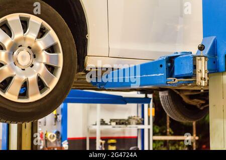 Car service - hydraulic ramp lift car Stock Photo