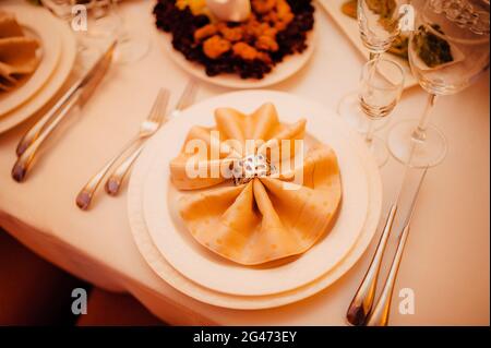 Table setting at a wedding banquet. Decoration flowers Stock Photo