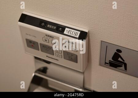 Buttons on a typical Japanese toilet in Tokyo, Japan Stock Photo
