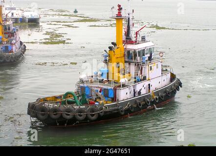 Tugboat sailing in the sea. Tugboat making maneuvers at cochin Port - Kerala ,India Stock Photo