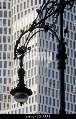 Old Berlin gas lantern in front of the modern high-rise Hotel Motel One Berlin-Upper West, Berlin Stock Photo