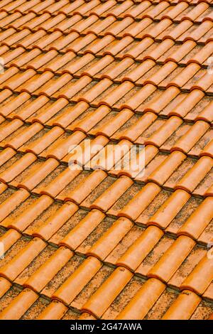 The texture of the orange new tiled roof. Stock Photo