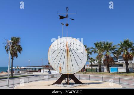Chipiona, Cadiz, Spain - June 13, 2021: Old sundial on the promenade of Chipiona ,Cádiz ,Andalusia ,Spain Stock Photo