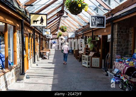 Interior of Great Torrington Pannier Market, Shops and Glass Roof Detail Looking Towards the Main Town Entrance and Torrington Square #2 Stock Photo