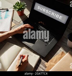 Subscribe button on device screen. Internet and digital marketing concept Stock Photo