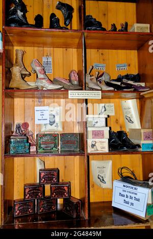 Old shoes shop display - Beamish Village, Durham County, England, United Kingdom, 12th of June 2021 Stock Photo