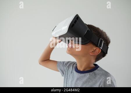 Schoolboy using virtual reality headset Stock Photo