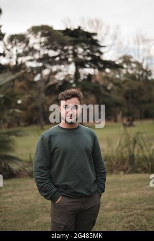 Portrait of a young Caucasian man in a park Stock Photo