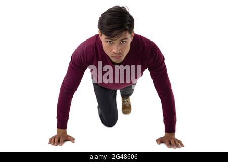 Portrait of businessman doing push ups Stock Photo