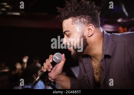 Male singer performing during music festival Stock Photo