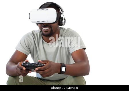 Man using virtual reality headset and playing video game Stock Photo