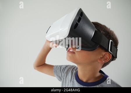 Schoolboy using virtual reality headset Stock Photo