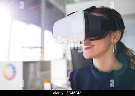 Female architect using virtual reality headset Stock Photo