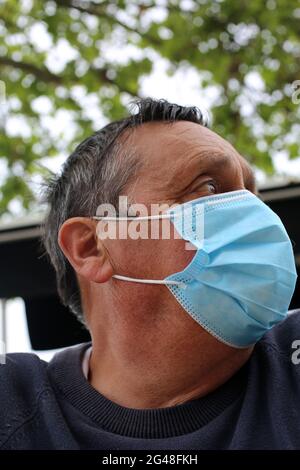 A man wearing a mask during the covid 19 pandemic. Stock Photo
