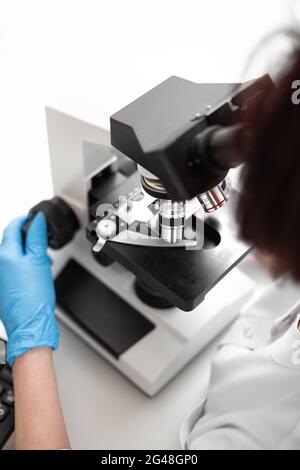 close up. scientists examining liquid samples in the lab. Medicine concept in laboratory. Stock Photo