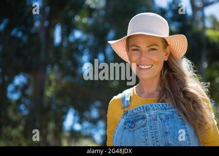 Portrait of smiling woman wearing hat Stock Photo
