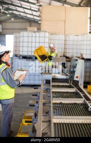 Technician and worker working together Stock Photo