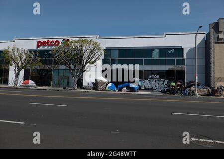 Los Angeles, CA USA - March 16, 2021: Homeless encampent in front of a Petco Store in Los Angeles Stock Photo