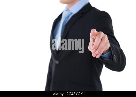 Mid section of businessman gesturing on invisible interface Stock Photo