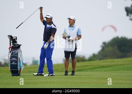 Hideki Matsuyama and caddie on the 6th fairway during the third round of the 2021 U.S. Open Championship in golf at Torrey Pines Golf Course in San Diego, California, USA on June 19, 2021. Credit: J.D. Cuban/AFLO/Alamy Live News Stock Photo