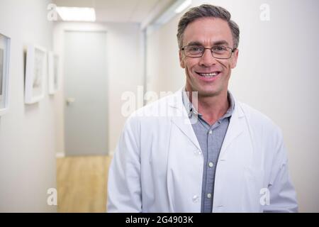Dentist standing at lobby in dental clinic Stock Photo