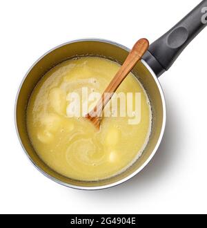 water, melted butter and salt in a pot for making eclair dough isolated on white background, top view Stock Photo