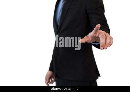 Mid section of businessman in suit using invisible interface Stock Photo