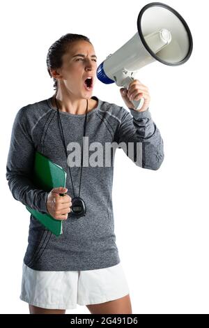 Young female coach announcing on megaphone Stock Photo