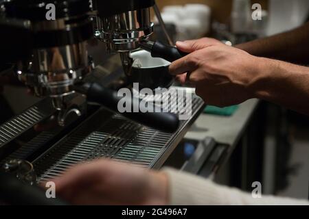 Waiter and waitress working at counter Stock Photo