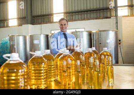 Portrait of manager maintaining record on clipboard Stock Photo