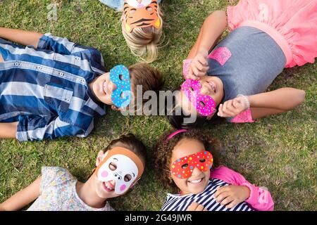 Overhead view of children wearing mask Stock Photo