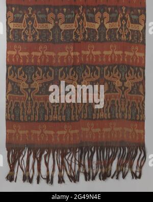 Dress, Ikat fabric, from SOEMBA. Rug of oriental textile; Ikat fabric. The pattern has horizontal jobs in red, black, gray and blue with animal figures: hunting hunting, birds and deer, between lobster. Along the top and bottom, frills walk from chain wires. Stock Photo
