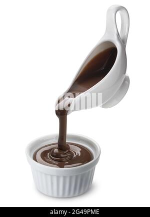 Pouring melted chocolate isolated on white background Stock Photo