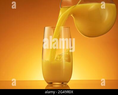 https://l450v.alamy.com/450v/2g49r0x/orange-juice-pouring-from-jug-into-glass-2g49r0x.jpg