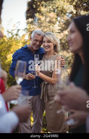 Affectionate couple having champagne in balcony Stock Photo