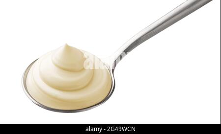 Mayonnaise in spoon isolated on white background Stock Photo
