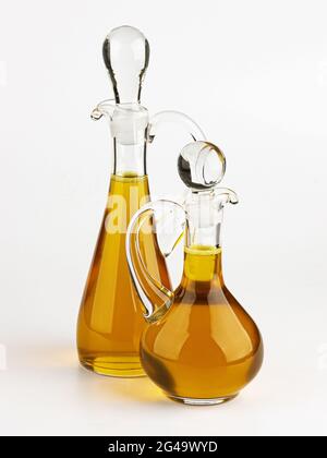 Glass decanter with olive oil on white background Stock Photo