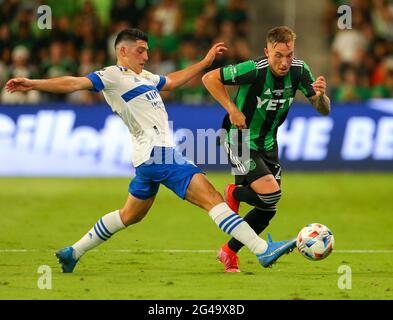 Austin, Texas, USA. 19th June, 2021. A San Jose Earthquakes player kicks the ball away from Austin FC defender Zan Kolmanic (21) during the second half of a Major League Soccer match between Austin FC and the San Jose Earthquakes on June 19, 2021 in Austin, Texas. The match finished a 0-0 draw. Credit: Scott Coleman/ZUMA Wire/Alamy Live News Stock Photo