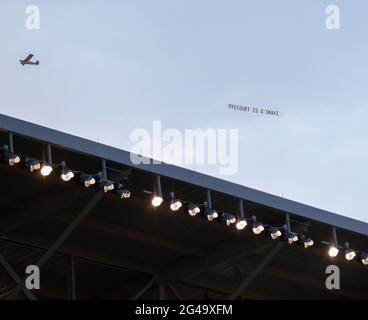 Austin, Texas, USA. 19th June, 2021. A plane flies over Q2 Stadium with a banner saying 'Precourt is a Snake'' referencing Austin FC majority owner and CEO Anthony Precourt during the first half of a Major League Soccer match between Austin FC and the San Jose Earthquakes on June 19, 2021 in Austin, Texas. Credit: Scott Coleman/ZUMA Wire/Alamy Live News Stock Photo