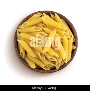 Penne rigate pasta in wooden bowl isolated on white background, top view Stock Photo