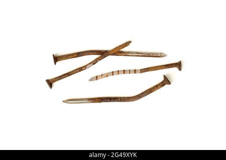 Old bent rusty nails isolated on white background Stock Photo