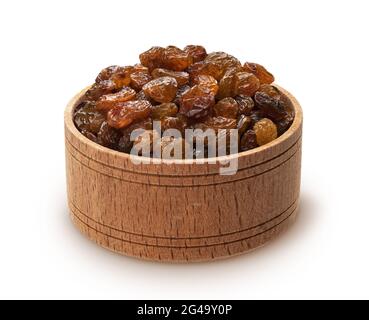 Raisins in wooden bowl isolated on white background Stock Photo