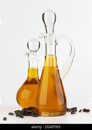 Decanter with sunflower oil isolated on white background Stock Photo