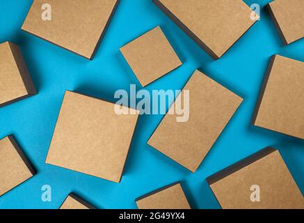 Brown cardboard boxes on blue background, top view Stock Photo