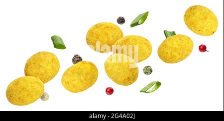 Falling coated peanuts isolated on white background Stock Photo